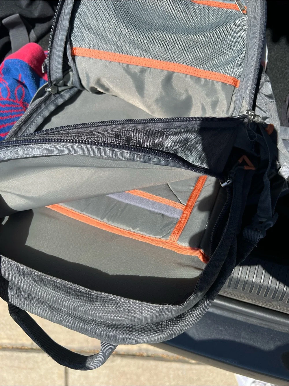 Thule Gray Backpack with Orange Pull Tabs